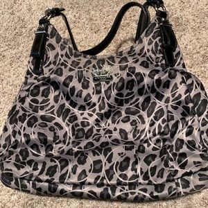 Coach large black purse in great condition. Three pockets with middle zipper.